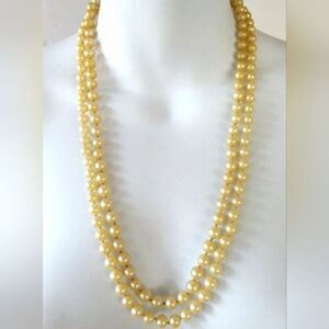 A SIGNED VINTAGE VENDOME 24" FAUX PEARL NECKLACE WITH GOLD TONE WHITE CRYSTALS